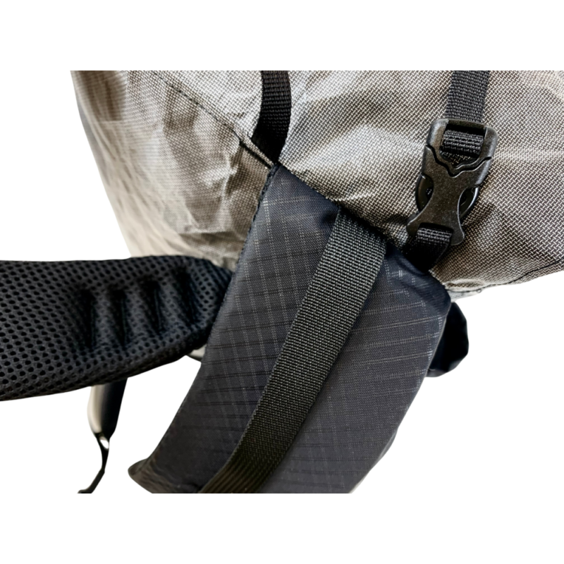 A detail view of the shoulder straps and top compression straps on the Burn 36L pack