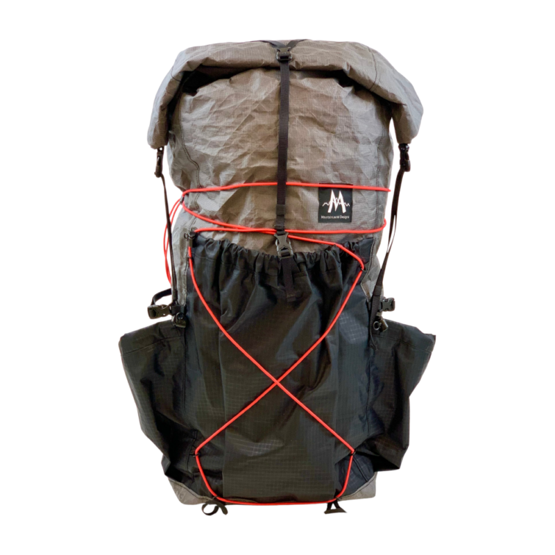 A front view of the Burn 36L pack, showing rear pocket, red shock cord, and roll top.