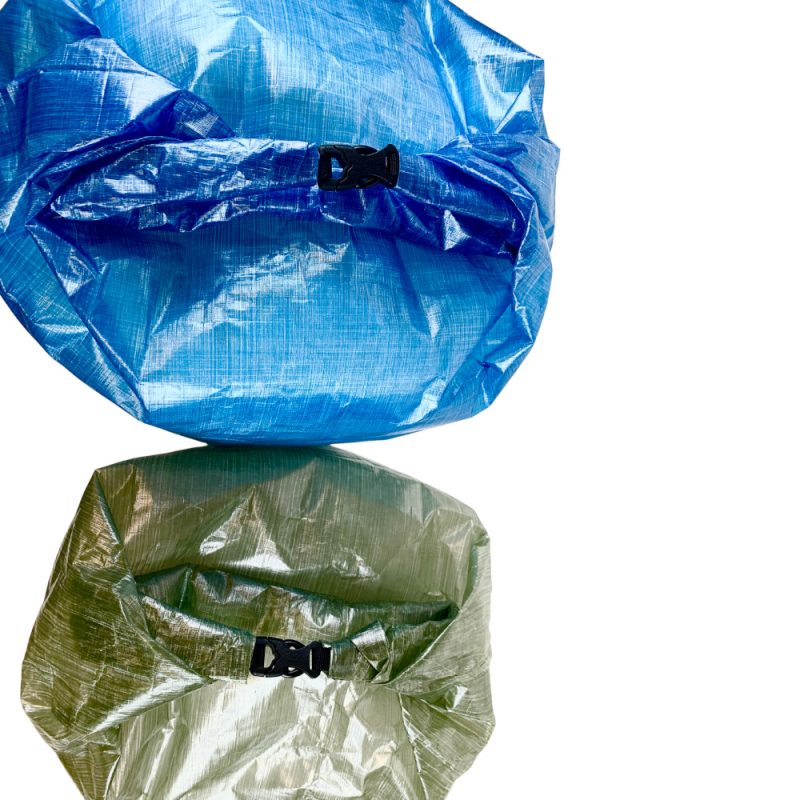 Roll top of a large blue and small green DCF Pack Liner