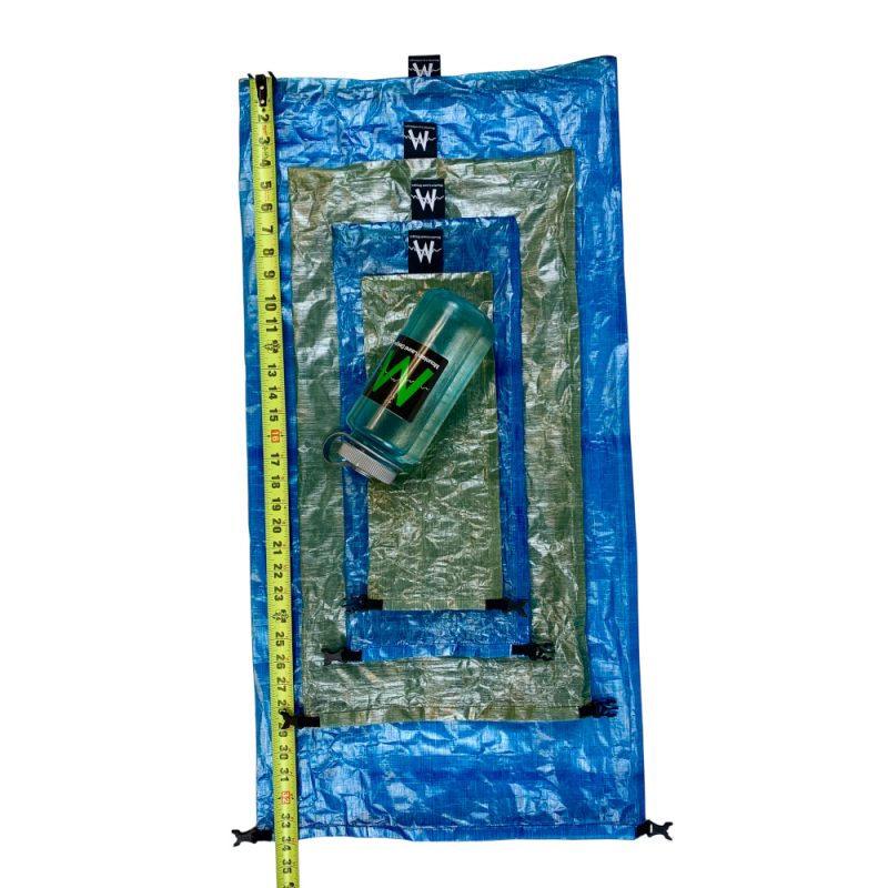 All sizes of DCF dry bags stacked ontop of each other, next to a measuring tape to show size differences
