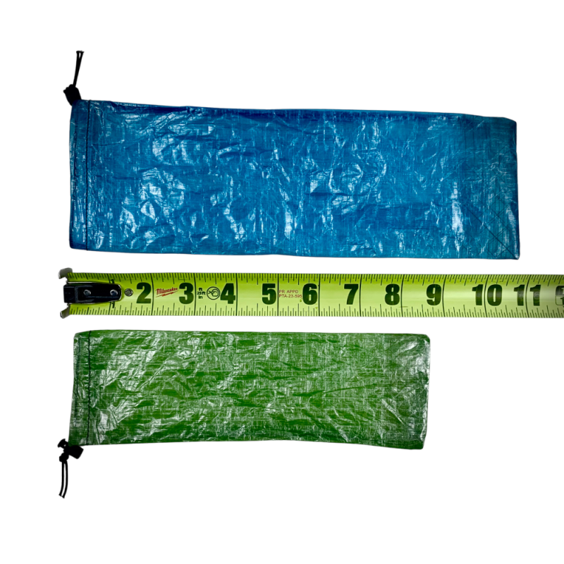 DCF Set Cinch Sacks in Small and Large next to a measuring tape