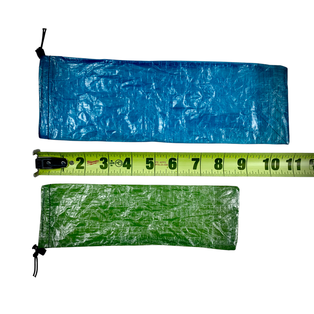DCF Set Cinch Sacks in Small and Large next to a measuring tape