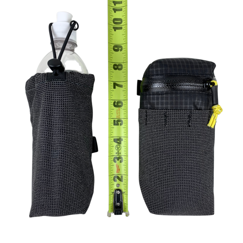 Water bottle pocket and gear pocket next to a measuring tape. Showing roughly 8" in height.