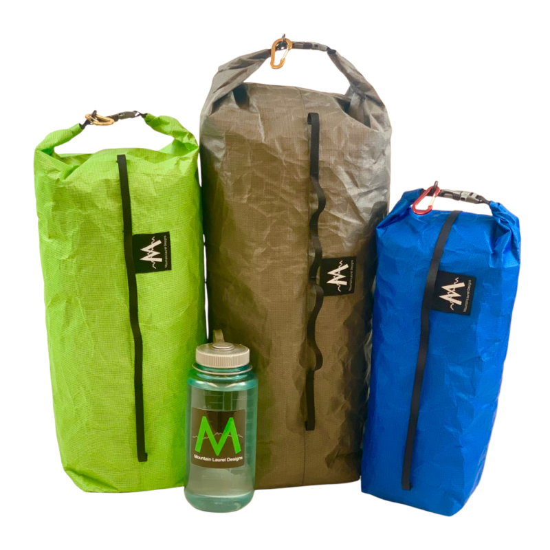 Ultra Bike Dry Bags: Medium Lime, Large Gray, Small Blue next to a water bottle for scale