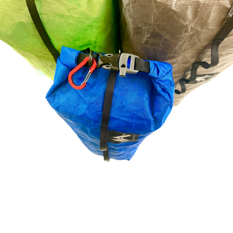 A Small blue Ultra Dry Bag strapped beneath two large dry bags, showing daisy chains and whistle buckles