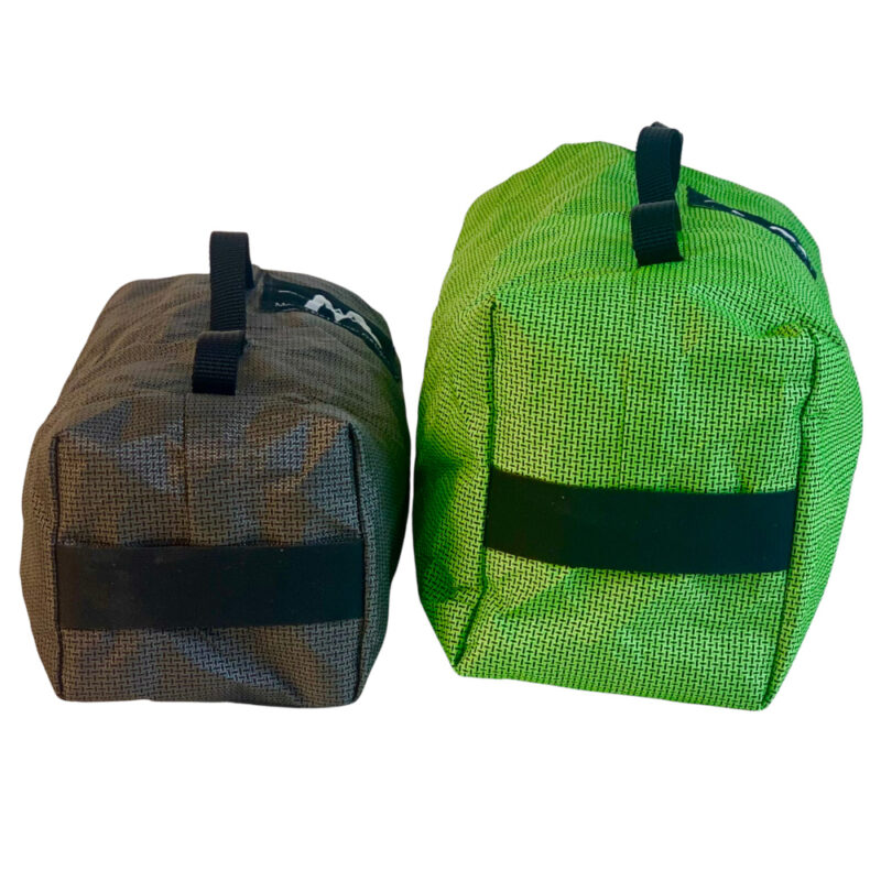 A back view of the Ultra Fork Dry Bags with the 1.6L on the left and the 2.5L on the right. Daisy chain is visible on side, and bottom strap is visible on bottom.