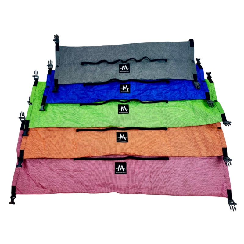 Double Ended Dry Bags laid flat to show all available colors. From top to bottom: Gray, Blue, Lime, Mandarin, and Fuchsia Raspberry