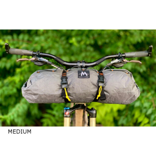Image shows a Largedouble-ended dry bag on the handlebars of a bicycle.