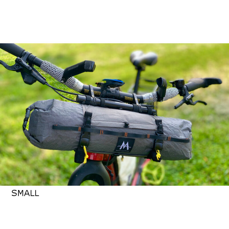 Image shows a Small double-ended dry bag on the handlebars of a bicycle.