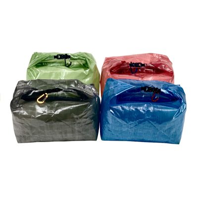 MLD Roll Top Ultralight Packing Cubes are available in four colors: red, grey, green, and blue.