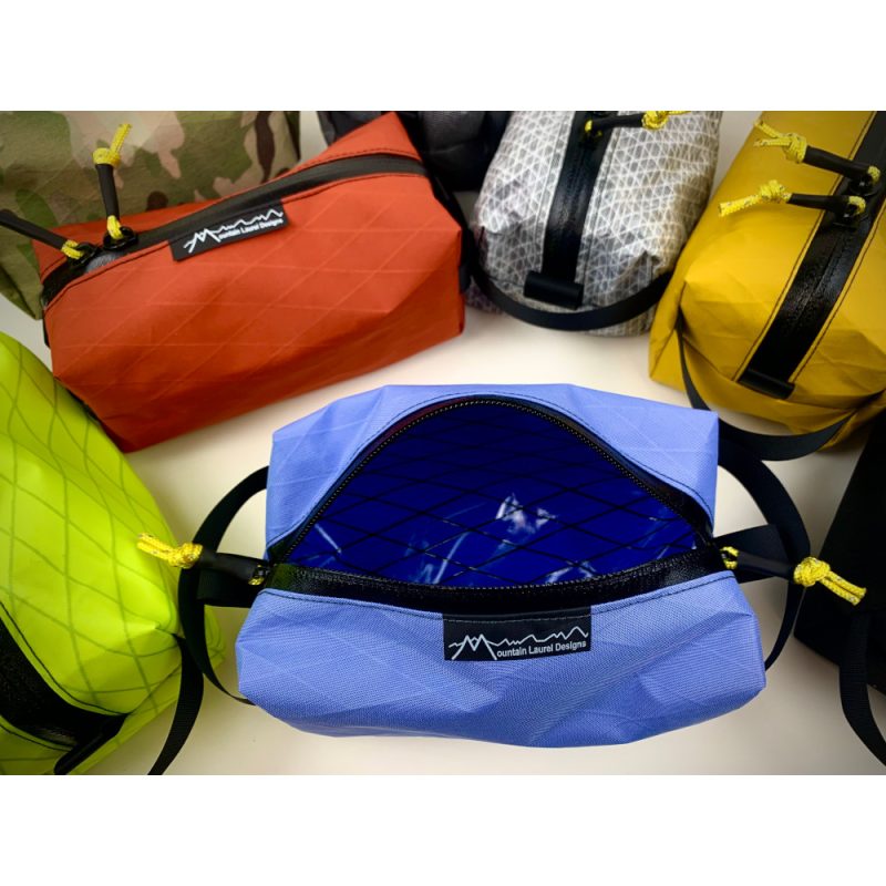 A Bluebell Dopp Kit Bag open to show interior space.