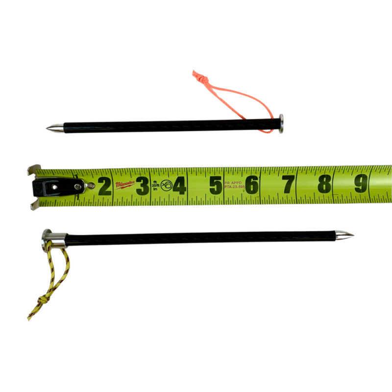 An 8.5" and a 6.5" stake next to a measuring tape.